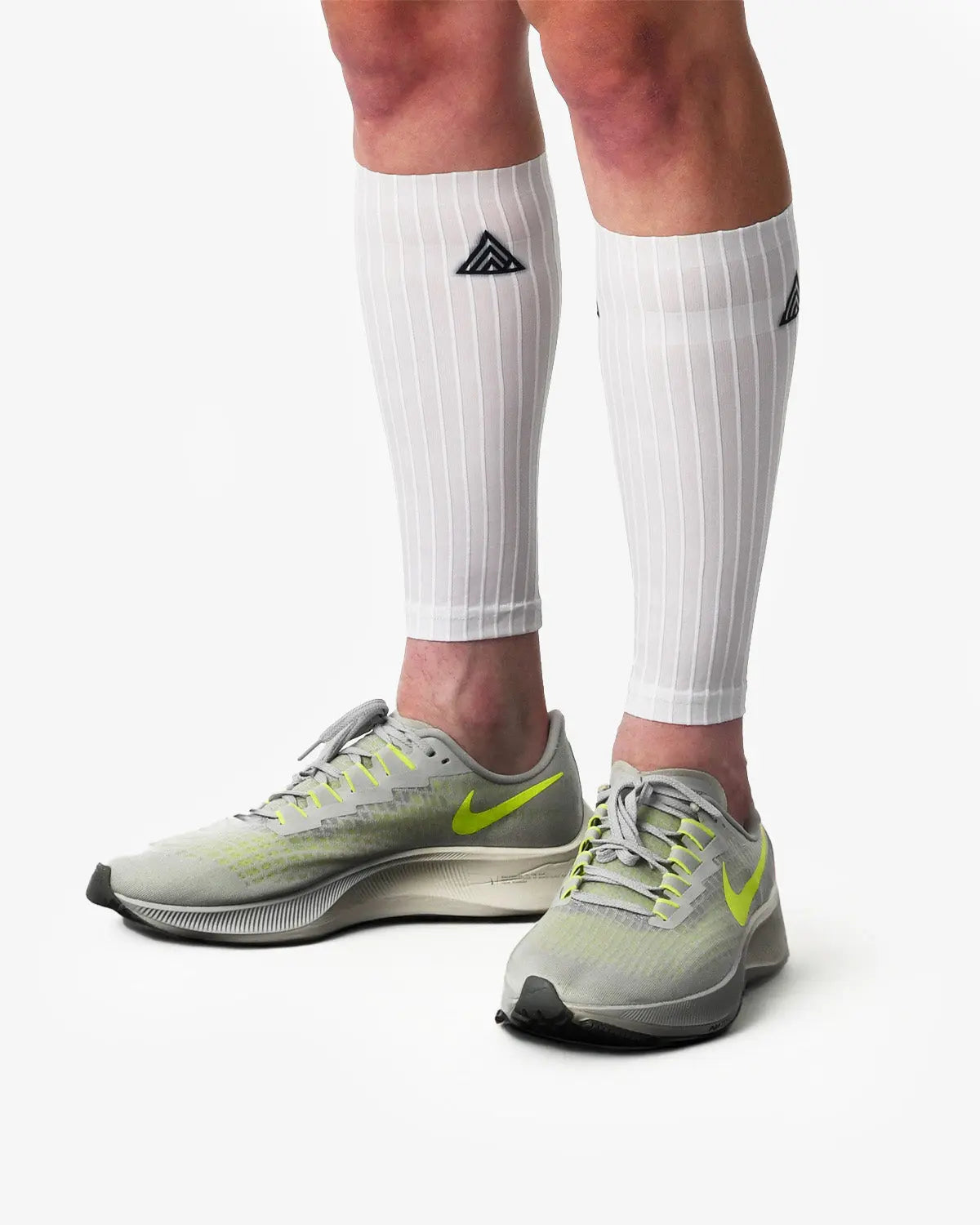 Rule 28 One Aero Calf Guards fitted on athlete's legs, textured surface for watt savings in triathlon.